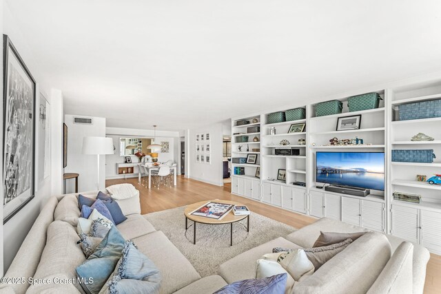 2100 N Atlantic Ave Unit 1110, Cocoa Beach, FL 32931 - living room with light wood-type flooring