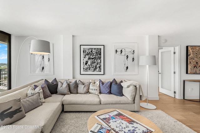 2100 N Atlantic Ave Unit 1110, Cocoa Beach, FL 32931 - living area featuring wood finished floors and baseboards