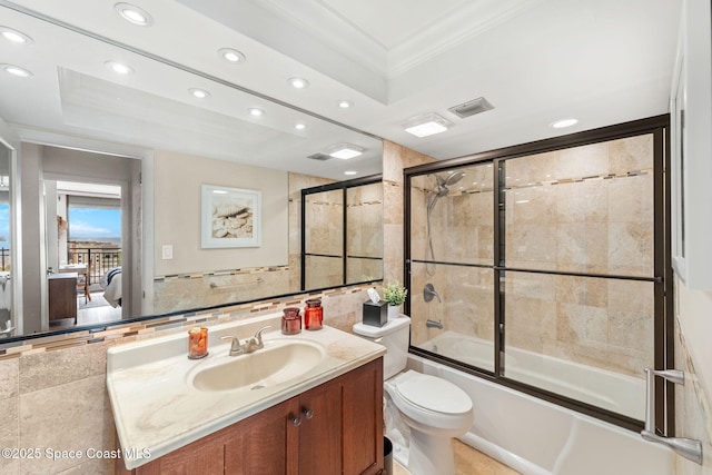 2100 N Atlantic Ave Unit 1110, Cocoa Beach, FL 32931 - ensuite bathroom featuring tile walls, recessed lighting, vanity, ornamental molding, and enclosed tub / shower combo