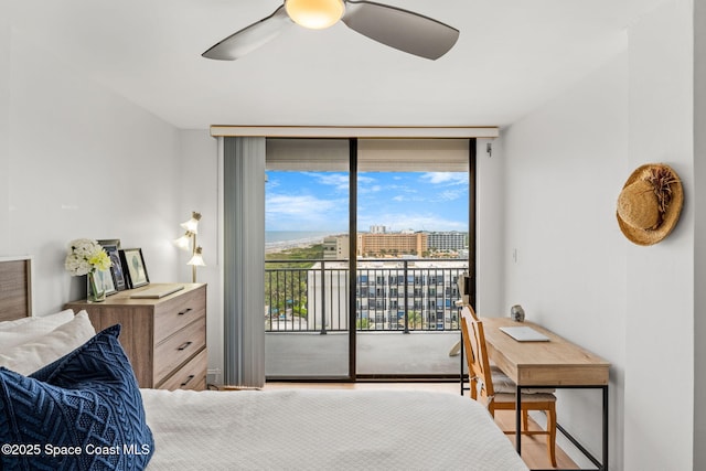 2100 N Atlantic Ave Unit 1110, Cocoa Beach, FL 32931 - bedroom with access to exterior, a wall of windows, a ceiling fan, and wood finished floors