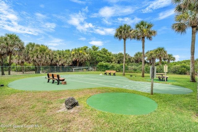 2100 N Atlantic Ave Unit 1110, Cocoa Beach, FL 32931 - surrounding community with shuffleboard and view of wooded area