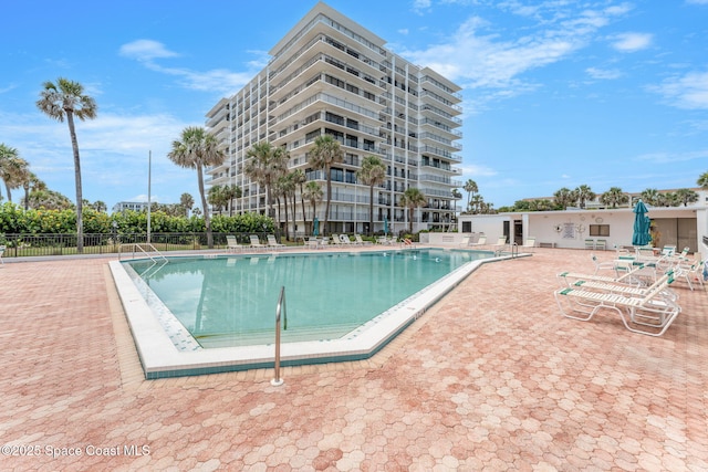 2100 N Atlantic Ave Unit 1110, Cocoa Beach, FL 32931 - community pool with a patio area