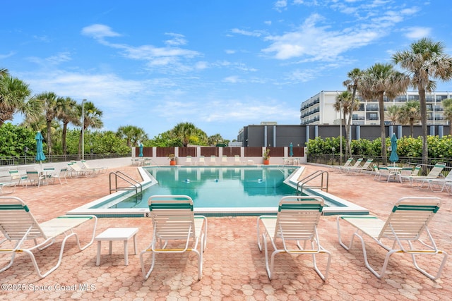 2100 N Atlantic Ave Unit 1110, Cocoa Beach, FL 32931 - community pool featuring a patio area