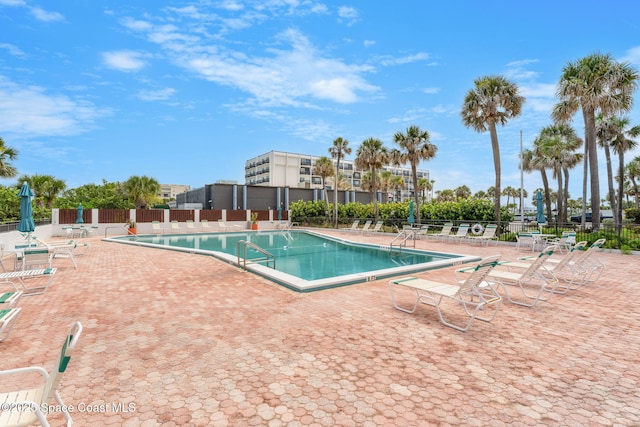 2100 N Atlantic Ave Unit 1110, Cocoa Beach, FL 32931 - community pool featuring a patio area