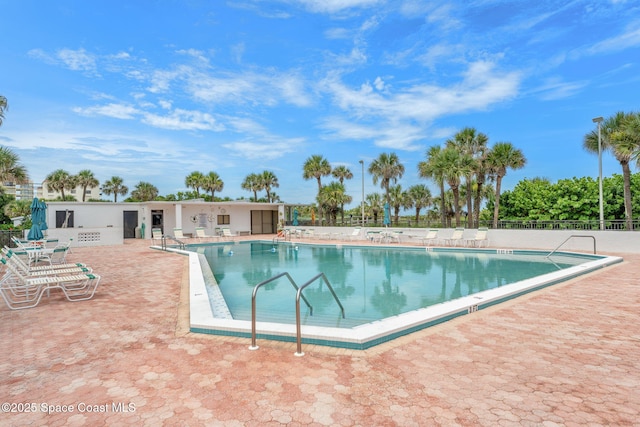 2100 N Atlantic Ave Unit 1110, Cocoa Beach, FL 32931 - community pool featuring a patio