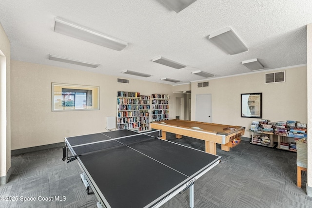 2100 N Atlantic Ave Unit 1110, Cocoa Beach, FL 32931 - rec room featuring dark colored carpet, billiards, and a textured ceiling