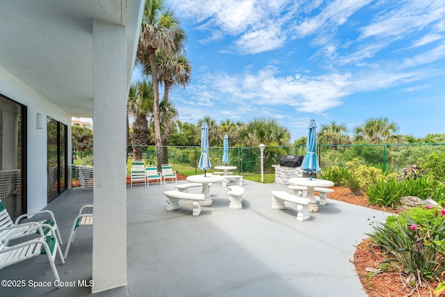 2100 N Atlantic Ave Unit 1110, Cocoa Beach, FL 32931 - view of patio featuring area for grilling