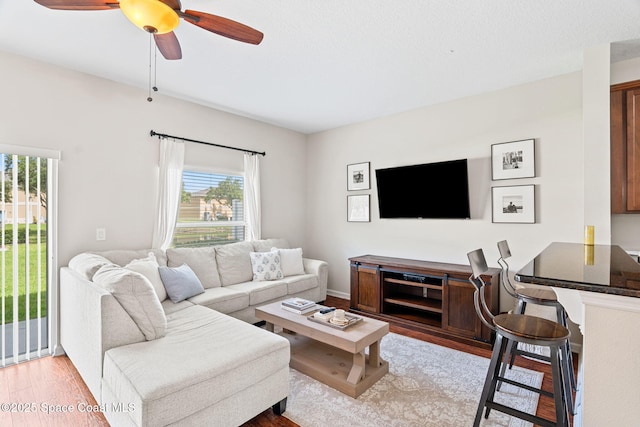 2710 Revolution St Unit 104, Melbourne, FL 32935 - living room with wood finished floors and a ceiling fan