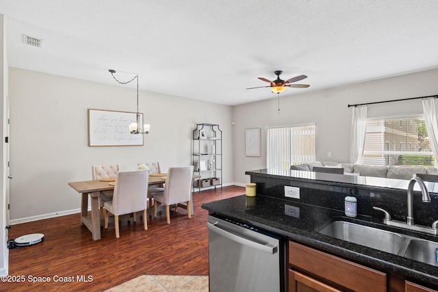 2710 Revolution St Unit 104, Melbourne, FL 32935 - kitchen with stainless steel dishwasher, plenty of natural light, ceiling fan, and open floor plan