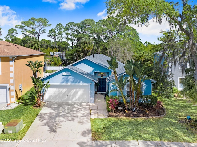 1652 La Maderia Dr, Palm Bay, FL 32908 - single story home featuring a garage, concrete driveway, a front lawn, and roof with shingles