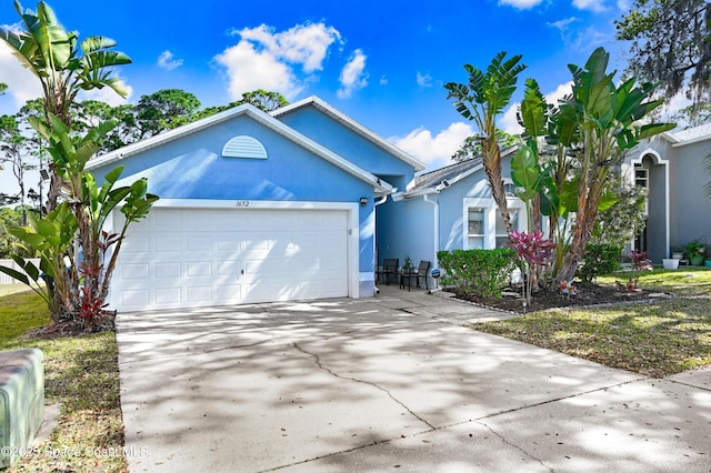 1652 La Maderia Dr, Palm Bay, FL 32908 - single story home with a garage, driveway, and stucco siding