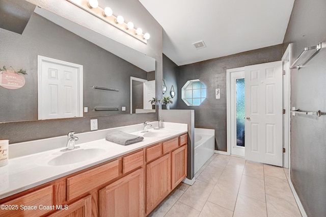 1652 La Maderia Dr, Palm Bay, FL 32908 - full bath with double vanity, a bath, and tile patterned floors