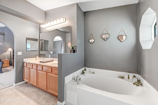 1652 La Maderia Dr, Palm Bay, FL 32908 - bathroom with double vanity, a garden tub, and tile patterned floors