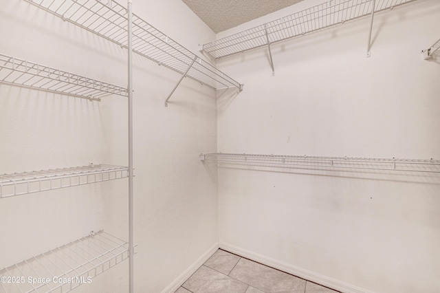 1652 La Maderia Dr, Palm Bay, FL 32908 - walk in closet featuring light tile patterned floors