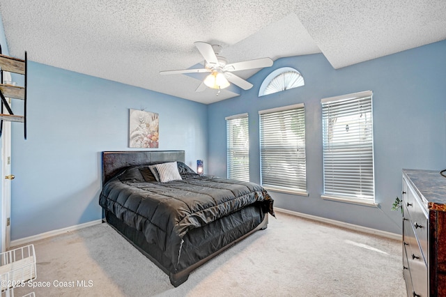 1652 La Maderia Dr, Palm Bay, FL 32908 - bedroom featuring lofted ceiling, carpet flooring, a ceiling fan, and a textured ceiling