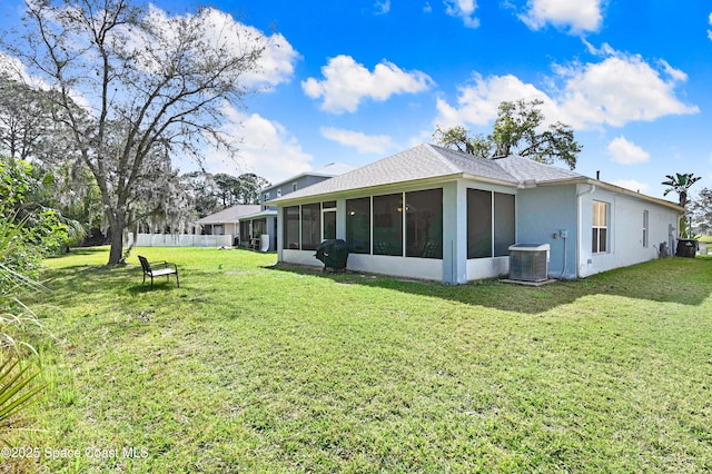 1652 La Maderia Dr, Palm Bay, FL 32908 - rear view of house with a sunroom and stucco siding