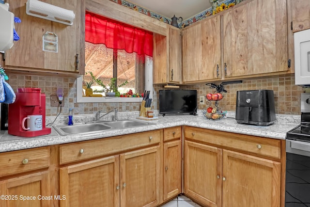 905 Spring St NW, Palm Bay, FL 32907 - kitchen with stainless steel electric range oven, backsplash, light countertops, and white microwave