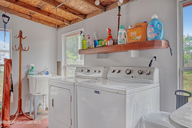 905 Spring St NW, Palm Bay, FL 32907 - laundry area featuring independent washer and dryer and healthy amount of natural light