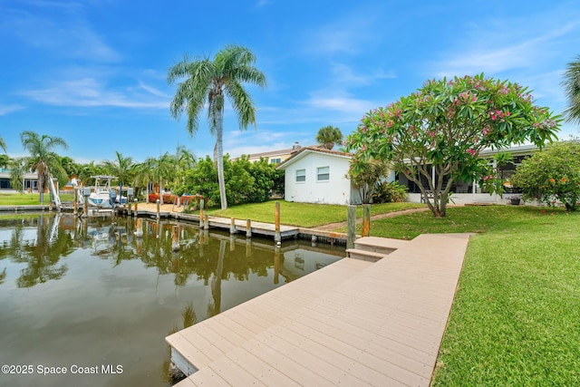 33 Yawl Dr, Cocoa Beach, FL 32931 - dock area with a water view and a yard