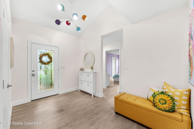 33 Yawl Dr, Cocoa Beach, FL 32931 - entrance foyer featuring light wood-type flooring and high vaulted ceiling