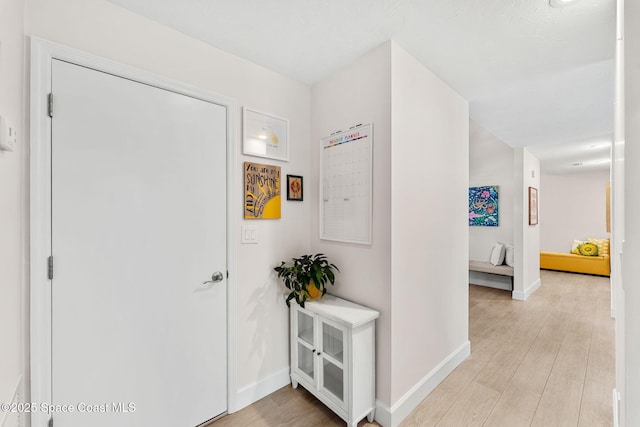 33 Yawl Dr, Cocoa Beach, FL 32931 - foyer entrance featuring baseboards and light wood-style floors