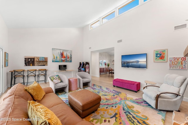 33 Yawl Dr, Cocoa Beach, FL 32931 - living area featuring wood finished floors and a towering ceiling