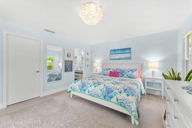 33 Yawl Dr, Cocoa Beach, FL 32931 - bedroom featuring light wood-type flooring and multiple windows