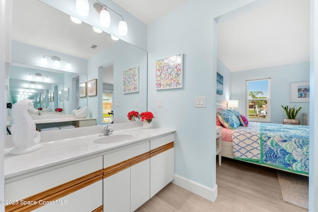 33 Yawl Dr, Cocoa Beach, FL 32931 - ensuite bathroom featuring vanity and wood finished floors