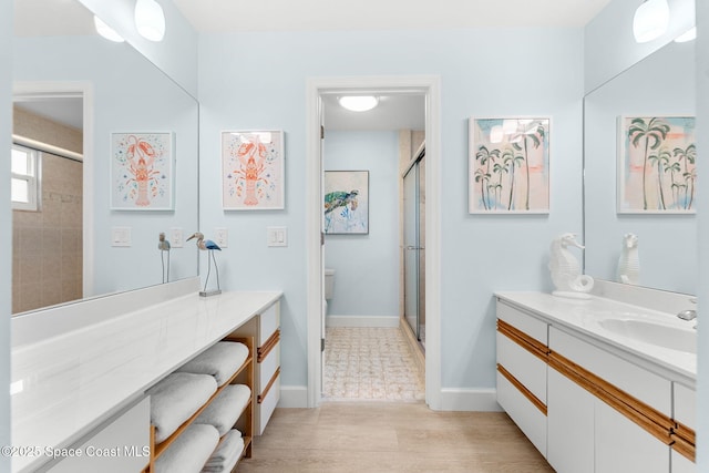 33 Yawl Dr, Cocoa Beach, FL 32931 - full bathroom with a stall shower, vanity, and wood finished floors