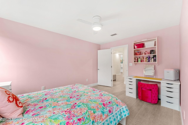 33 Yawl Dr, Cocoa Beach, FL 32931 - bedroom with light wood finished floors and a ceiling fan
