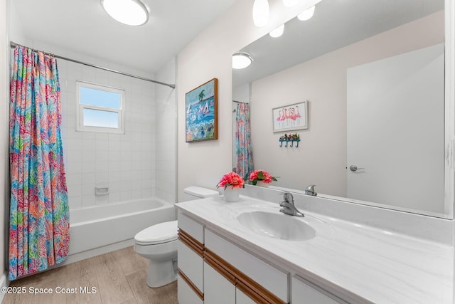 33 Yawl Dr, Cocoa Beach, FL 32931 - full bath with vanity, wood finished floors, and shower / bathtub combination with curtain