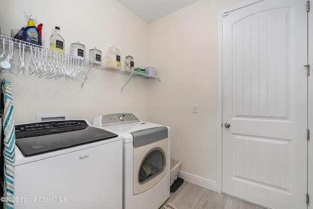 1441 Waco Blvd SE, Palm Bay, FL 32909 - laundry area with washing machine and dryer and light wood-style floors
