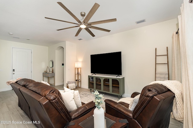 1441 Waco Blvd SE, Palm Bay, FL 32909 - living area featuring ceiling fan, light wood-type flooring, and arched walkways