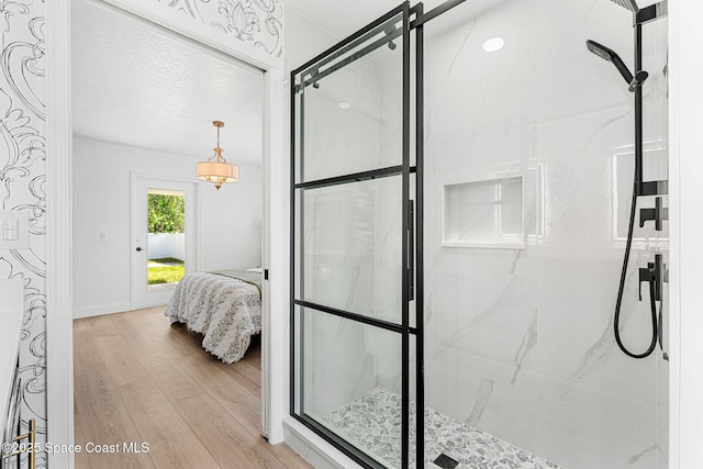 494 Fernandina St NW, Palm Bay, FL 32907 - bathroom featuring a stall shower and wood finished floors