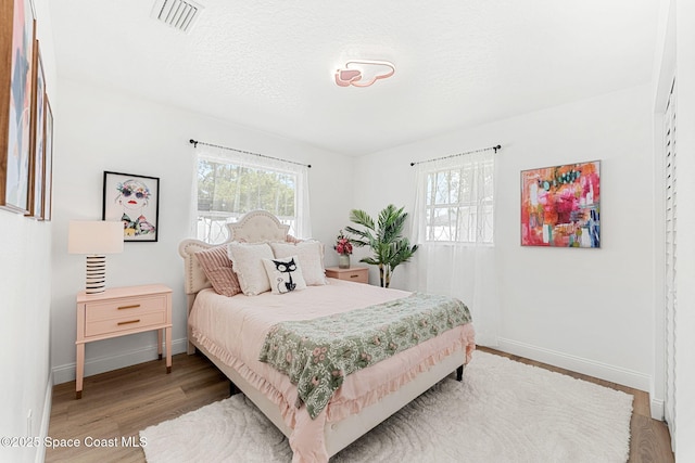 494 Fernandina St NW, Palm Bay, FL 32907 - bedroom featuring light wood finished floors and baseboards