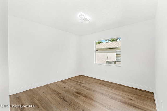 494 Fernandina St NW, Palm Bay, FL 32907 - spare room with wood finished floors and baseboards