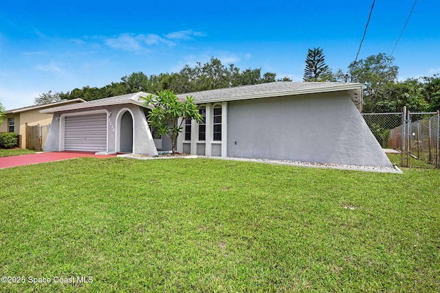 1216 Cannon St, Melbourne, FL 32935 - view of front facade with stucco siding, concrete driveway, and an attached garage