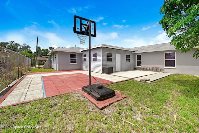 1216 Cannon St, Melbourne, FL 32935 - rear view of property featuring a fenced backyard, a patio, and stucco siding