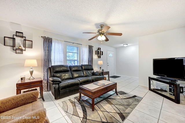 1216 Cannon St, Melbourne, FL 32935 - living room with ceiling fan, light tile patterned flooring, and a textured ceiling