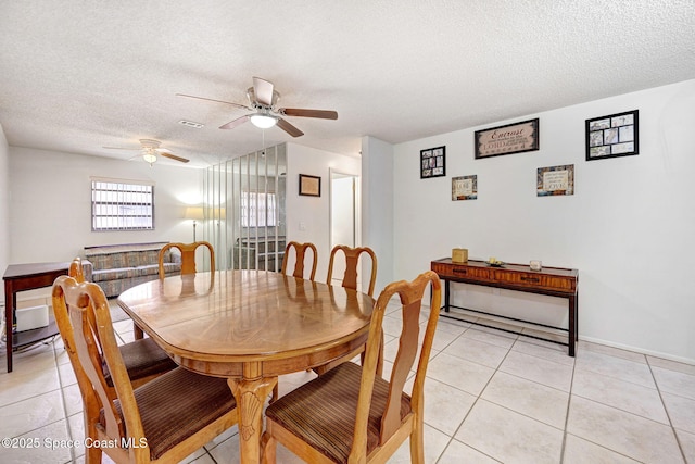 1216 Cannon St, Melbourne, FL 32935 - dining room with light tile patterned floors, a textured ceiling, and ceiling fan