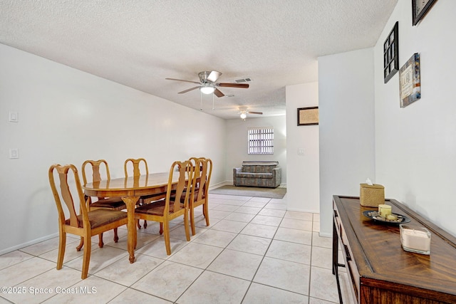 1216 Cannon St, Melbourne, FL 32935 - dining space featuring ceiling fan, a textured ceiling, and light tile patterned floors