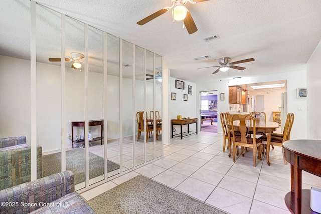 1216 Cannon St, Melbourne, FL 32935 - dining area with ceiling fan, light tile patterned flooring, and a textured ceiling