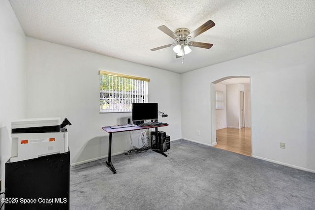 1216 Cannon St, Melbourne, FL 32935 - office area with arched walkways, a ceiling fan, carpet floors, and a textured ceiling