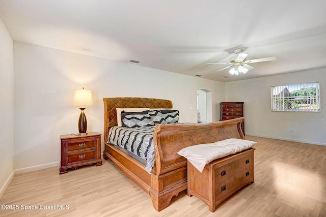 1216 Cannon St, Melbourne, FL 32935 - bedroom featuring light wood-style floors, arched walkways, and a ceiling fan