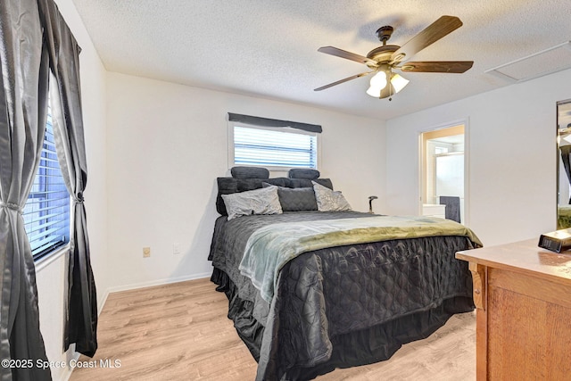 1216 Cannon St, Melbourne, FL 32935 - bedroom with light wood finished floors, a textured ceiling, a ceiling fan, and ensuite bath