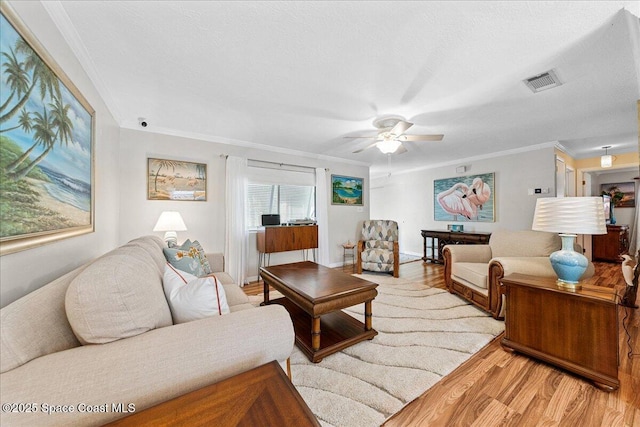 2975 Matthew Dr, Rockledge, FL 32955 - living room featuring wood finished floors, ornamental molding, and ceiling fan