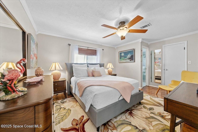 2975 Matthew Dr, Rockledge, FL 32955 - bedroom with light wood-type flooring, crown molding, a textured ceiling, a ceiling fan, and ensuite bath