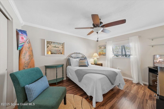 2975 Matthew Dr, Rockledge, FL 32955 - bedroom featuring crown molding, wood finished floors, and a ceiling fan