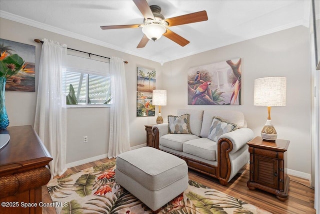 2975 Matthew Dr, Rockledge, FL 32955 - living area with wood finished floors, a ceiling fan, and ornamental molding