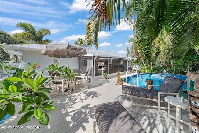 2975 Matthew Dr, Rockledge, FL 32955 - outdoor pool featuring a deck and a sunroom